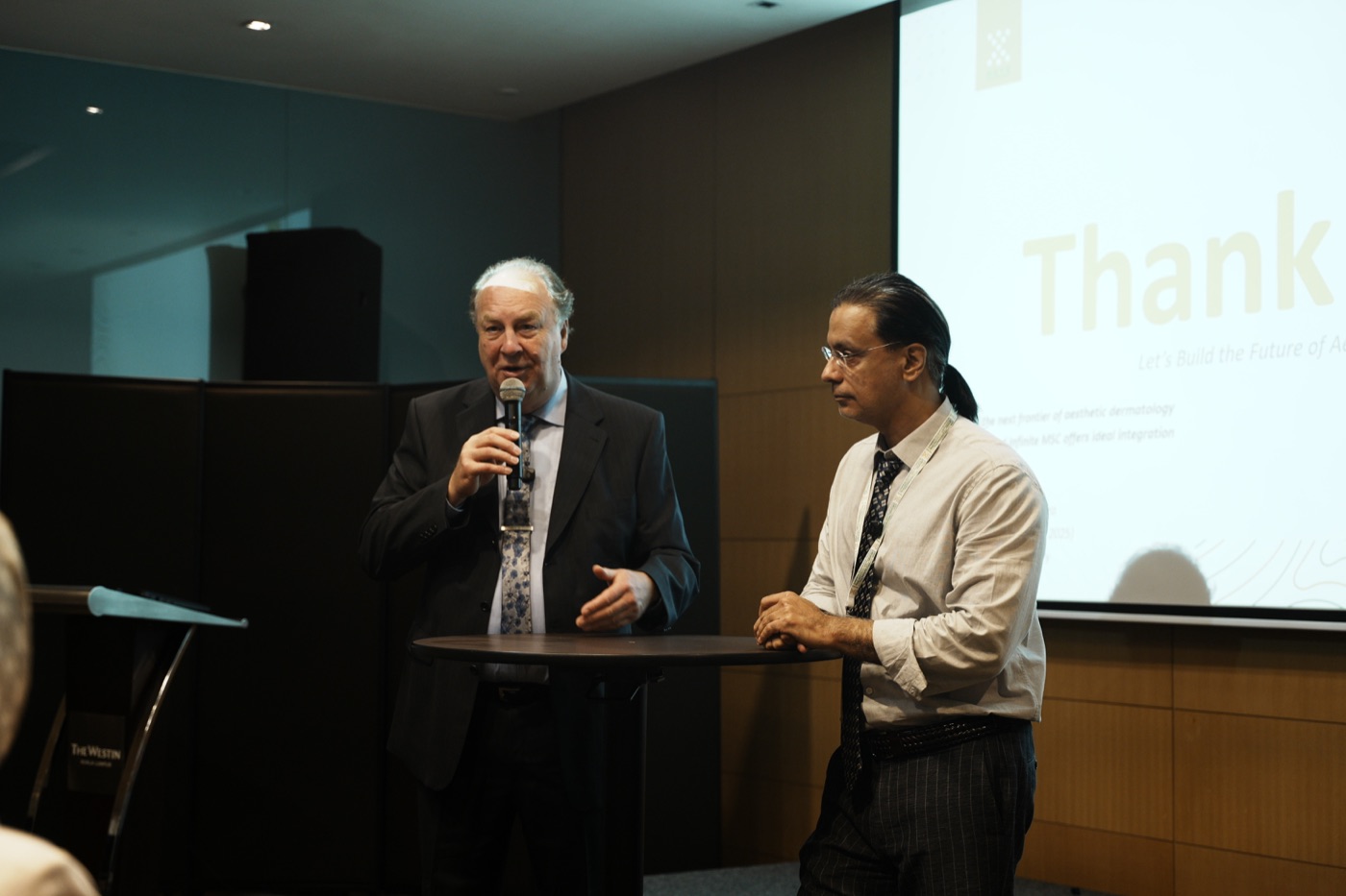 Specialists collaborating during a symposium session