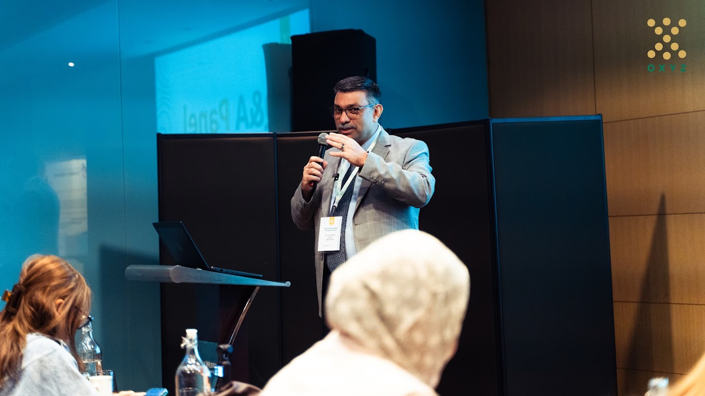 Specialists collaborating during a symposium session